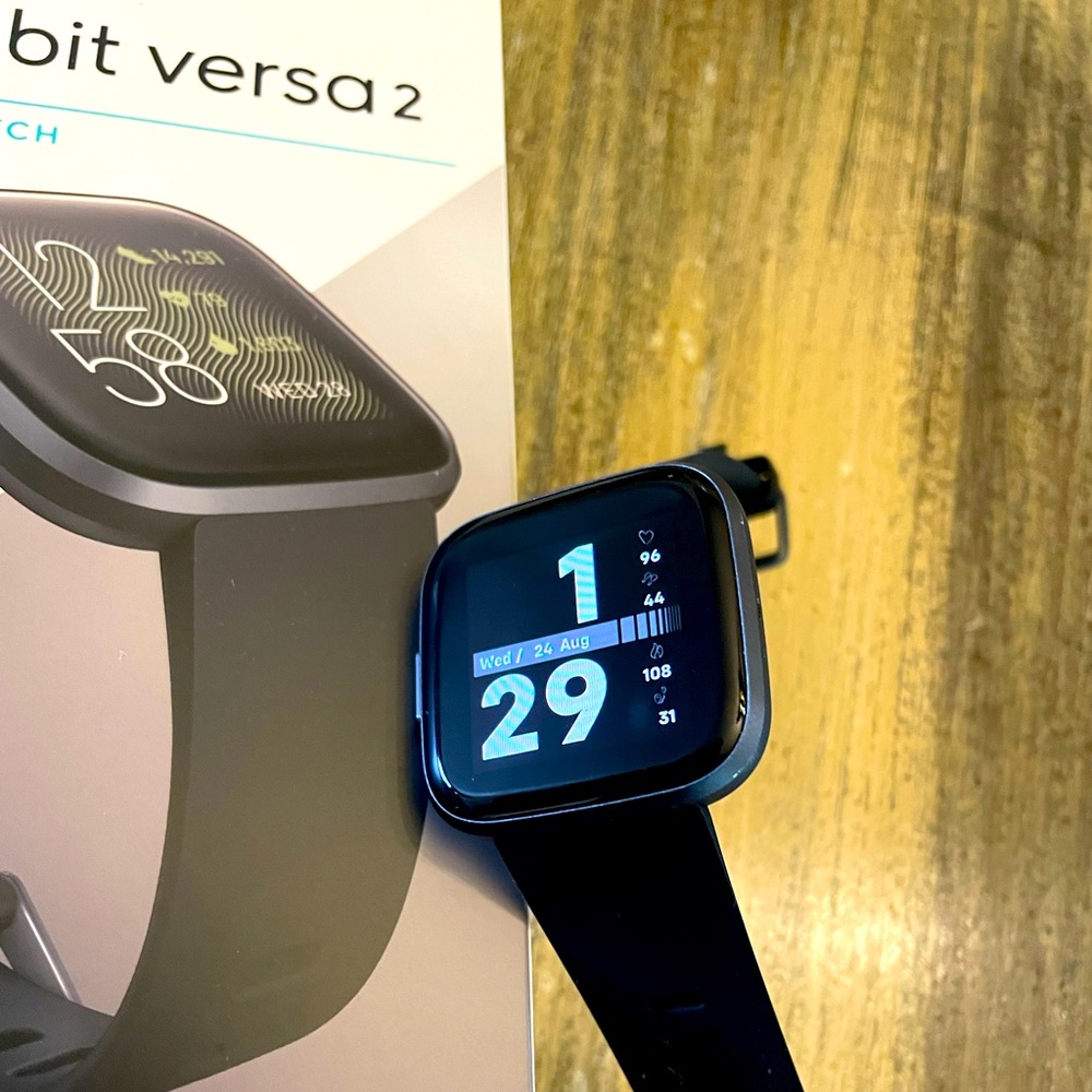 Fitbit Versa 2. Screen protectors and extra bands included.